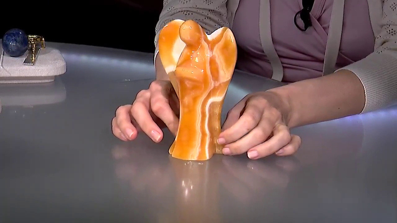 Video Figuur met een Oranje Calciet