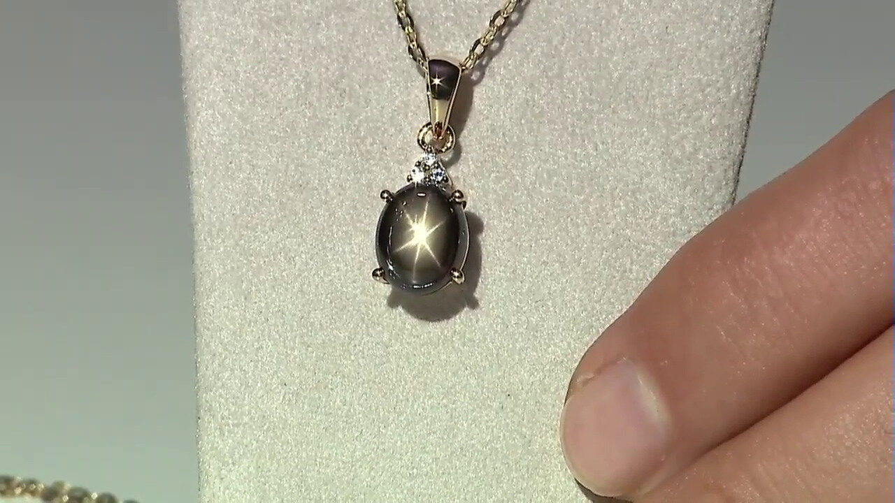 Video Zilveren hanger met een zwarte ster saffier