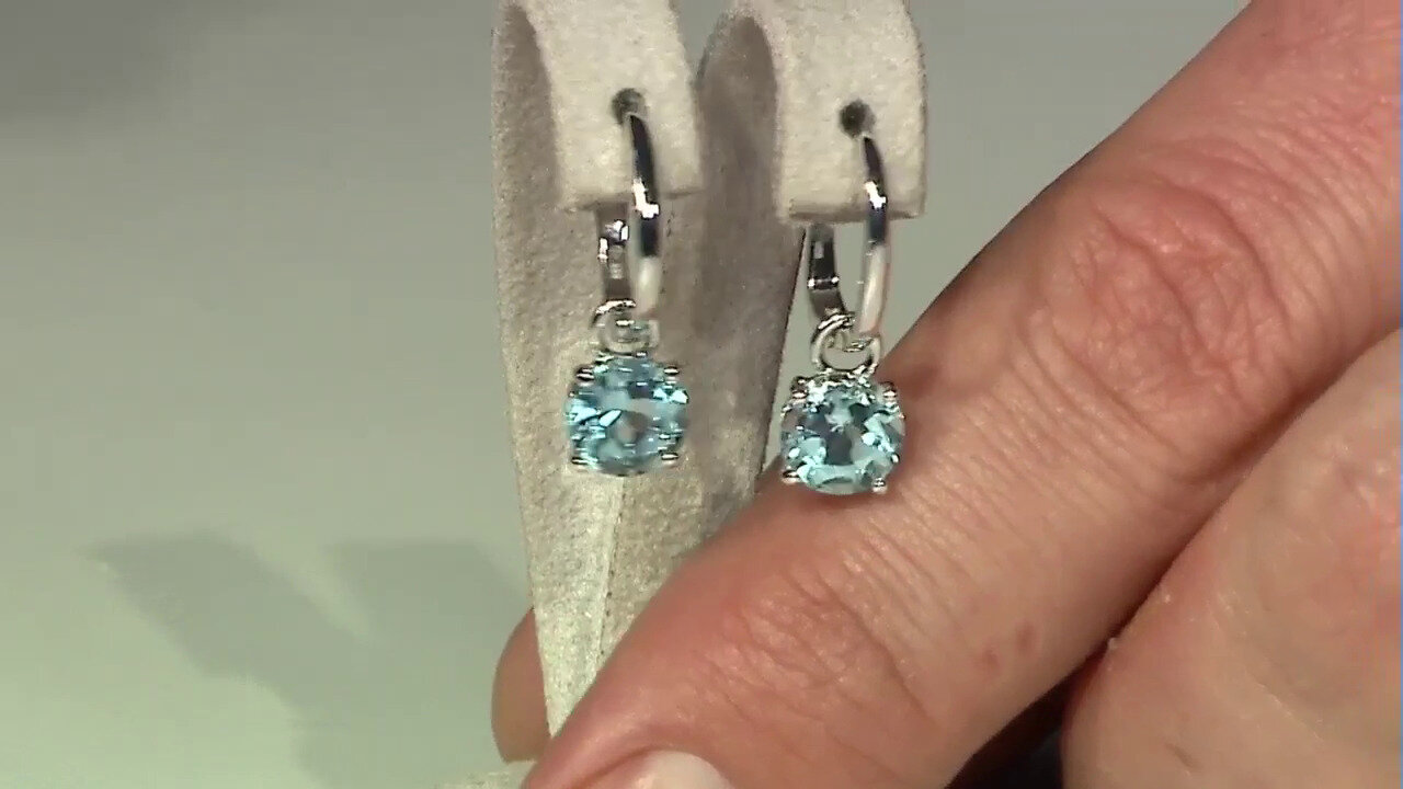Video Zilveren oorbellen met hemel-blauwe topaasstenen