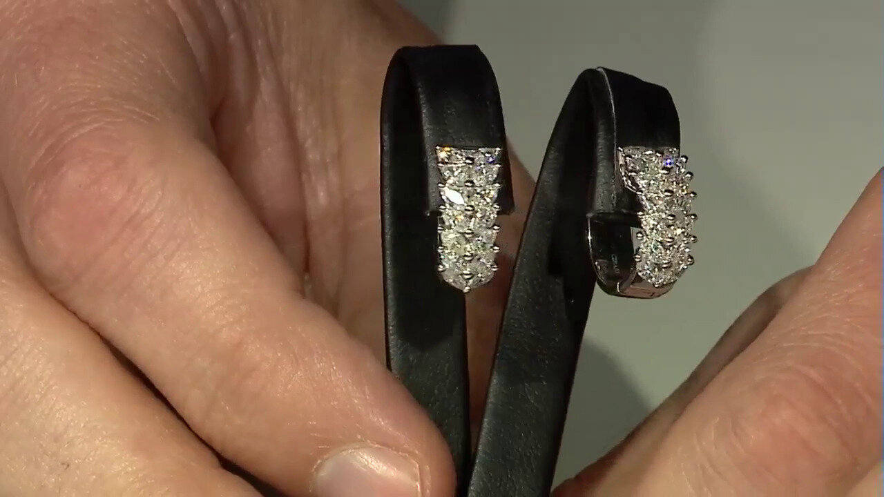 Video Gouden oorbellen met SI1 (H) Diamanten (CIRARI)