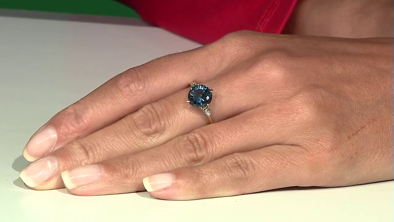 Video Gouden ring met een Londen-blauwe topaas