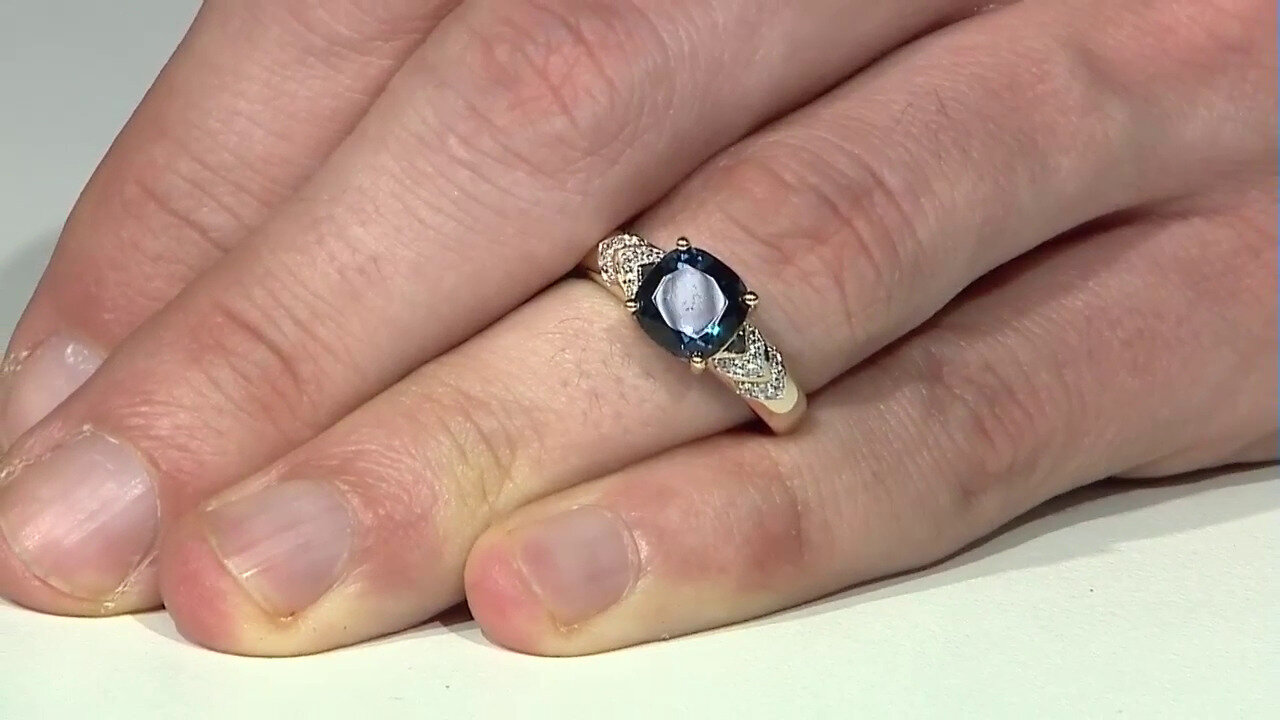 Video Gouden ring met een Londen-blauwe topaas