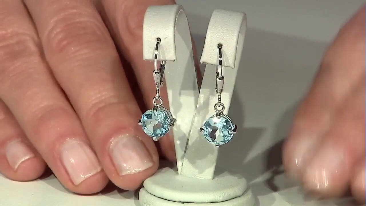Video Zilveren oorbellen met hemel-blauwe topaasstenen
