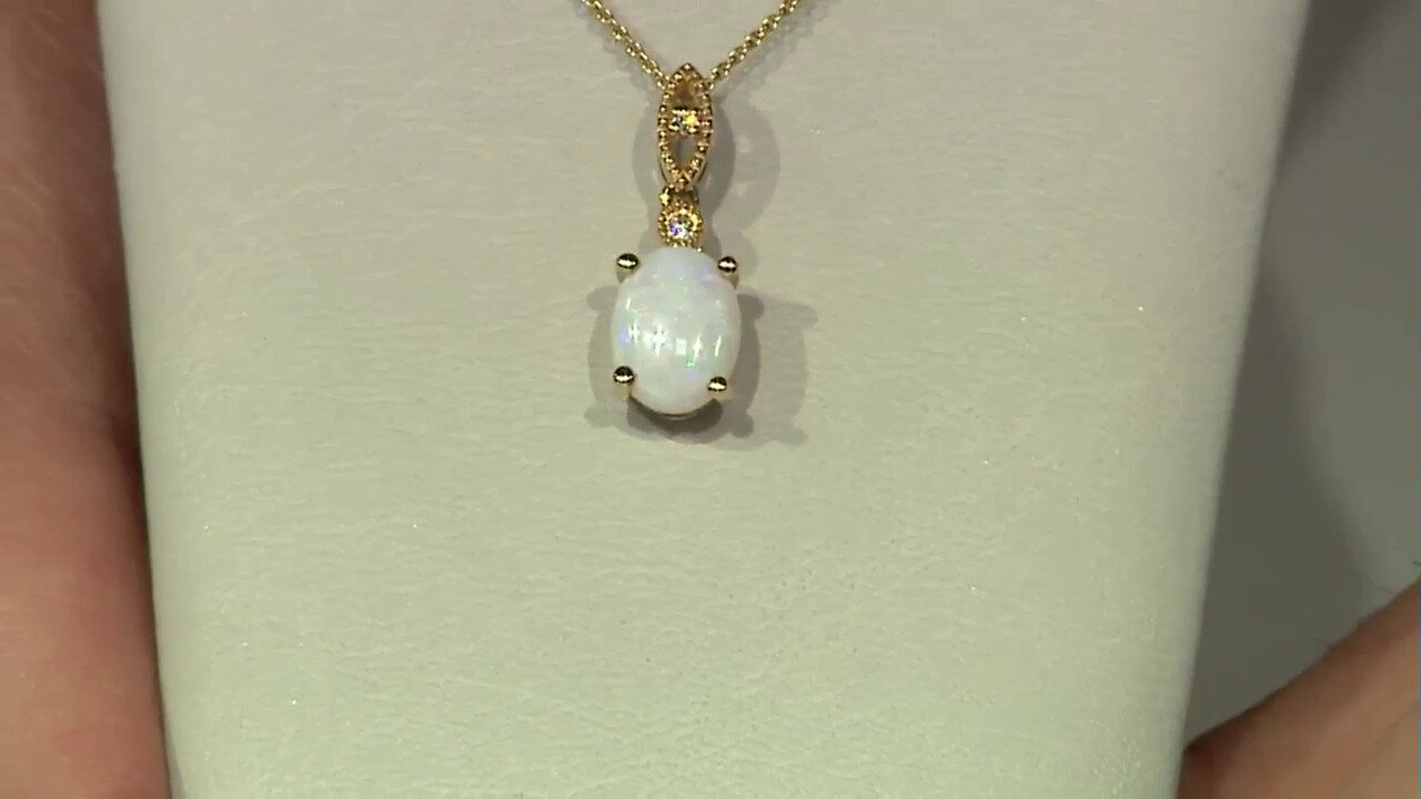 Video Gouden halsketting met een witte opaal