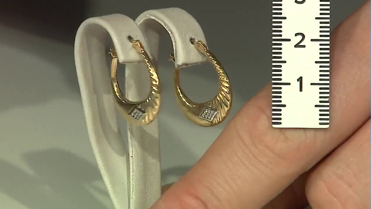 Video Gouden oorbellen met een PK (H) Diamant