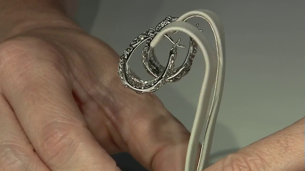 Video Zilveren oorbellen met I3 (I) Diamanten