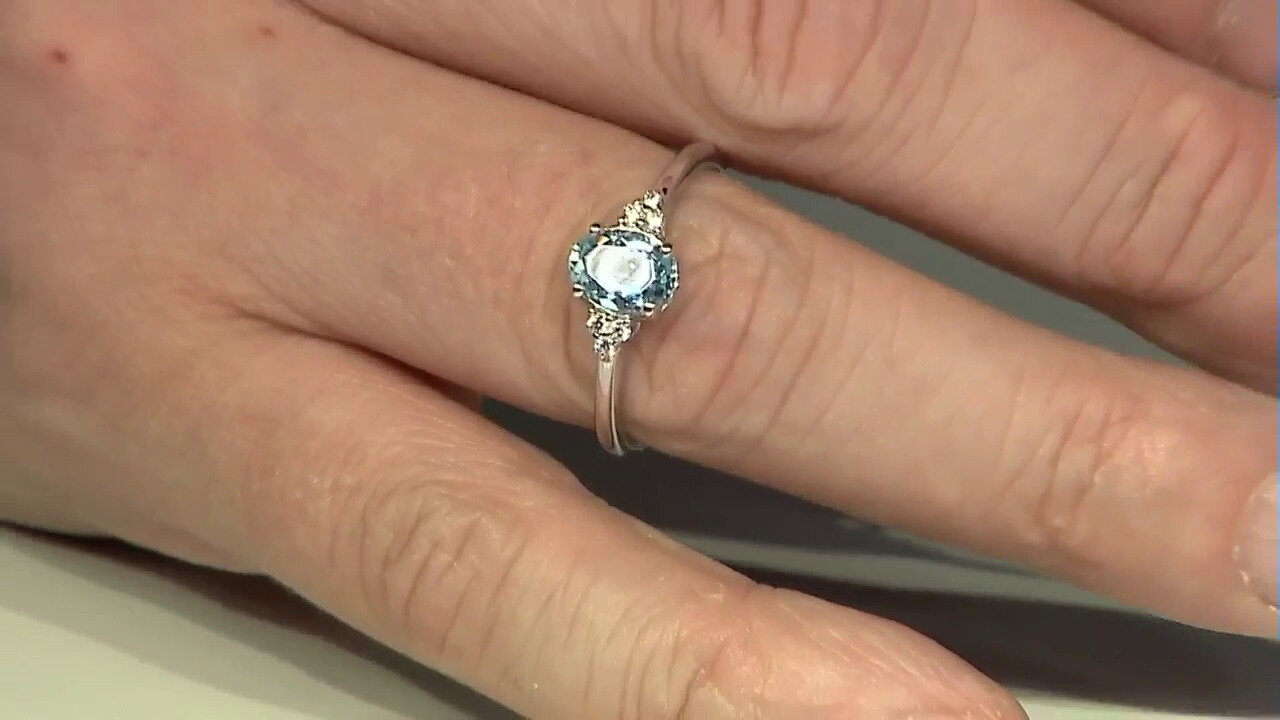 Video Zilveren ring met een hemel-blauwe topaas