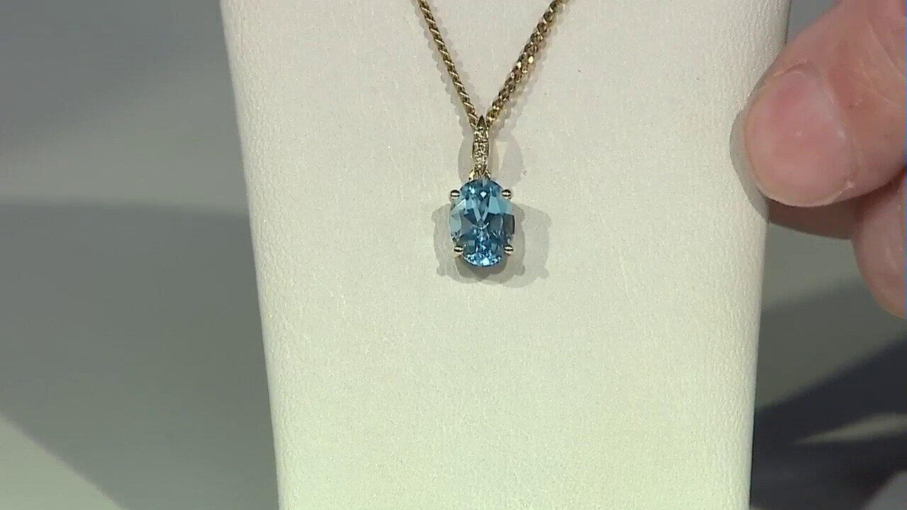 Video 9K Swiss Blue Topaz Gold Pendant