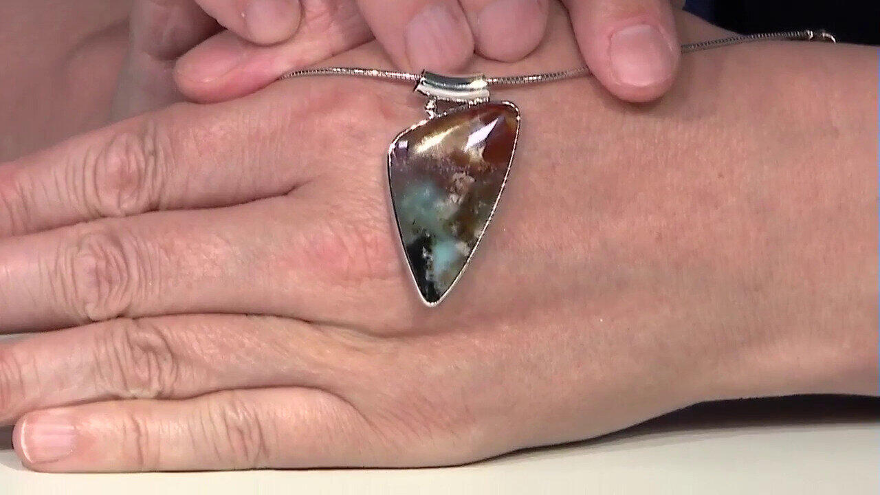 Video Ciondolo in argento con Legno pietrificato opalizzato (Bali Barong)