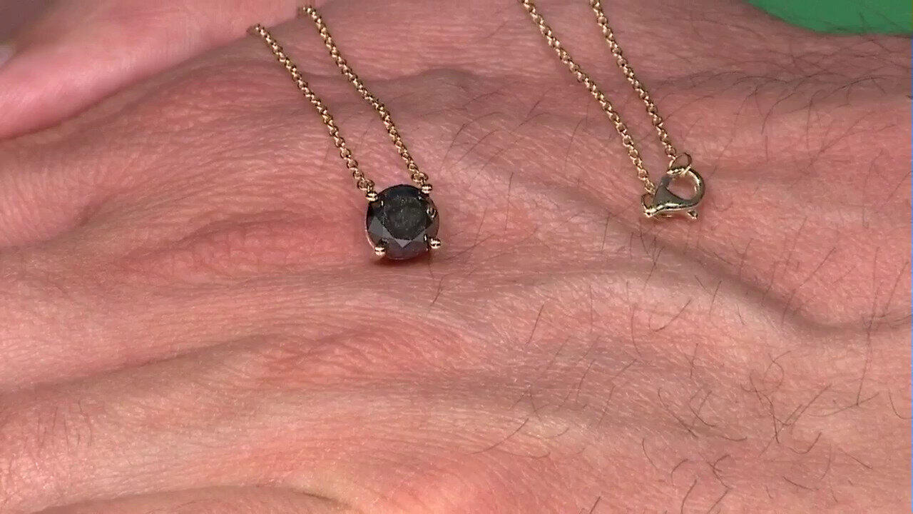 Video Gouden hanger met een zwarte diamant (de Melo)