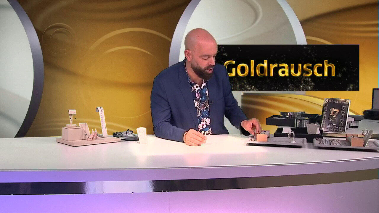 Video Gouden oorbellen met Zwitsers-blauwe topaasstenen
