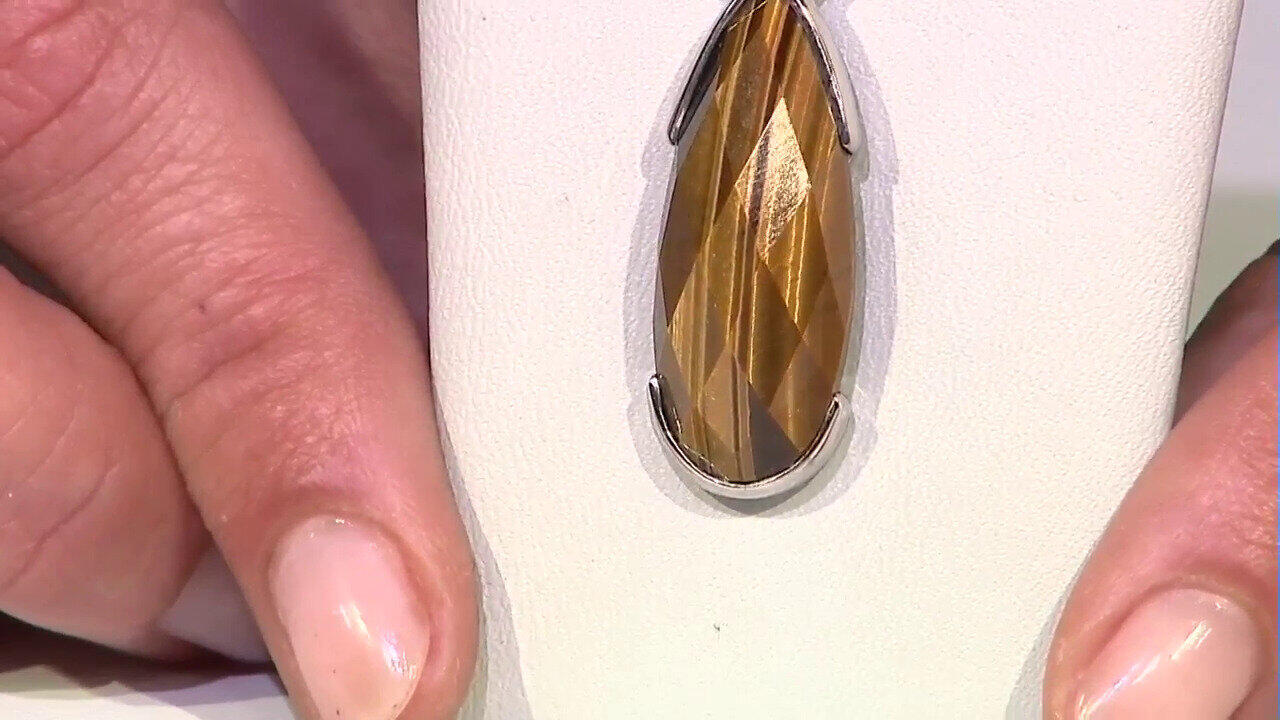 Video Colgante en plata con Ojo de tigre dorado (Bali Barong)
