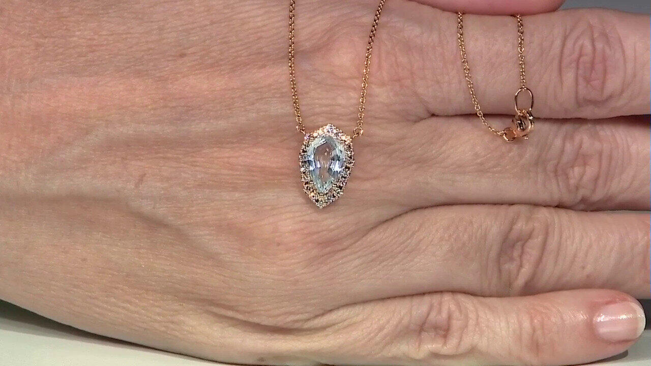 Video Gouden halsketting met een hemel-blauwe topaas (Nara Jewelry)
