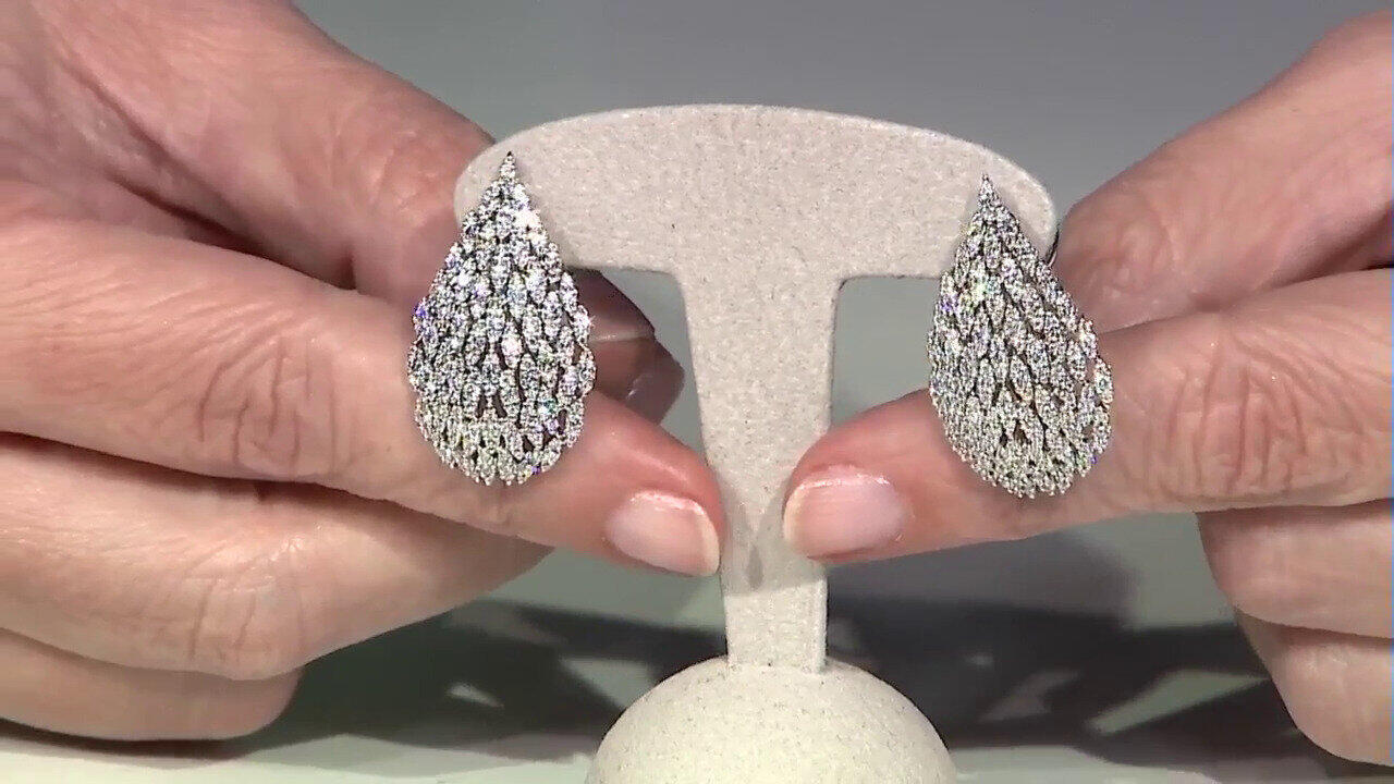 Video Gouden oorbellen met SI1 (H) Diamanten (Nara Jewelry)