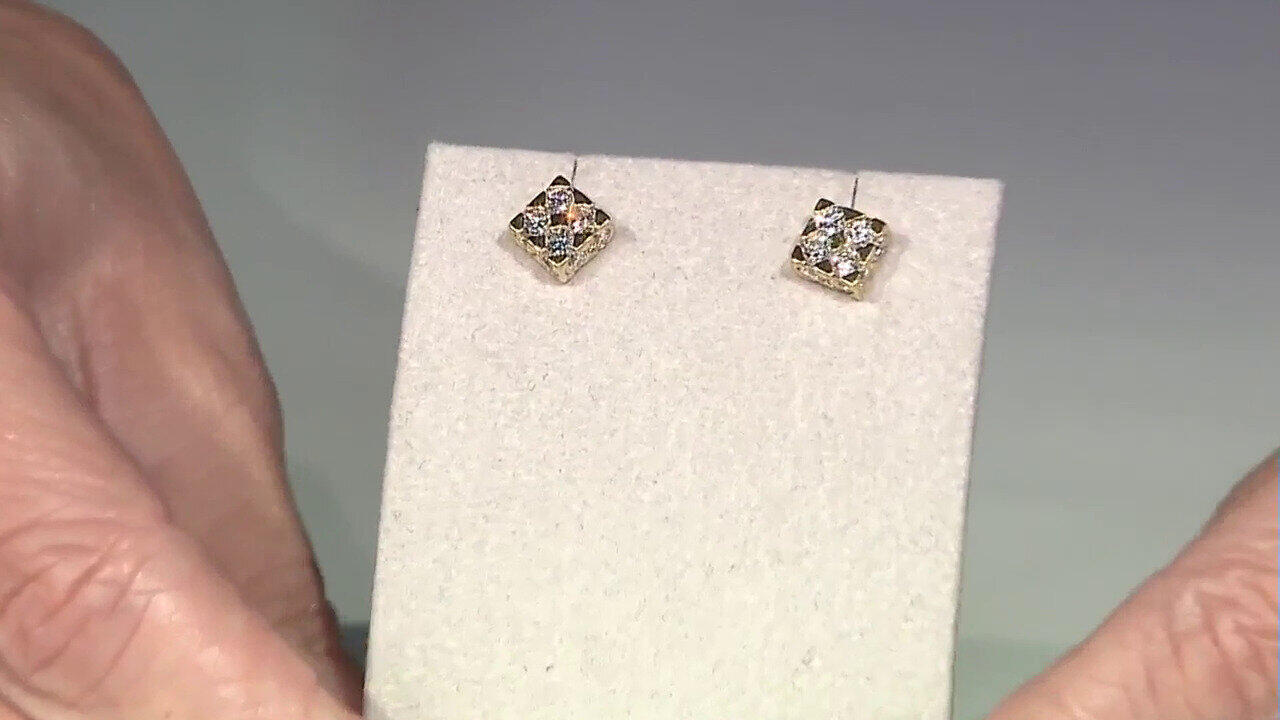 Video Gouden oorbellen met SI1 (H) Diamanten (Nara Jewelry)