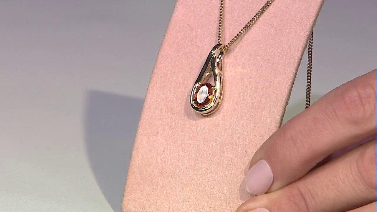 Video Gouden hanger met een Ceylon hessoniet