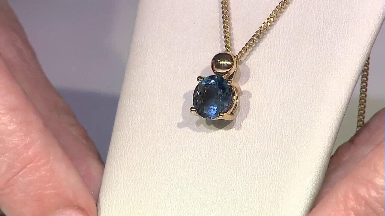 Video Colgante en oro con Topacio azul de Londres (de Melo)