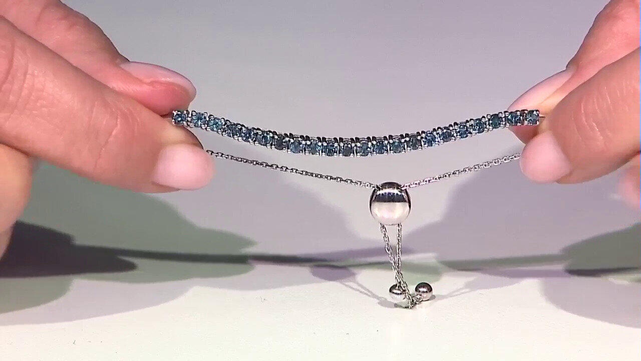 Video Gouden armband met Londen-blauwe topaasstenen